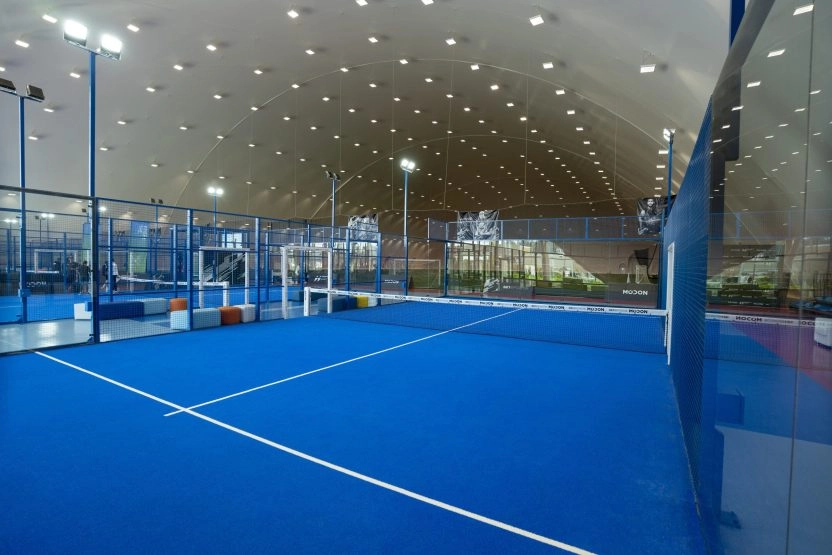 Padel lesson taking place at 321 Sports Club on Hudayriyat Island in Abu Dhabi, with players training under professional coaching in a modern outdoor facility.