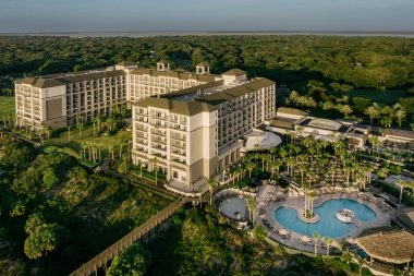 Aerial view of the Ritz-Carlton Amelia Island resort and oceanfront pool overlooking the Atlantic Ocean.