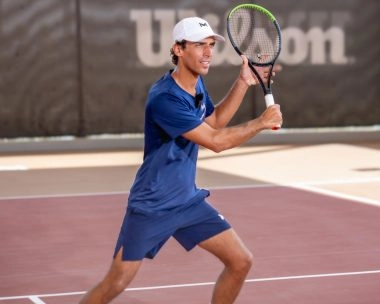 Coach Jaime in action at Mouratoglou Tennis Center Hudayriyat Island in Abu Dhabi, demonstrating expert technique and dynamic movement during training.
