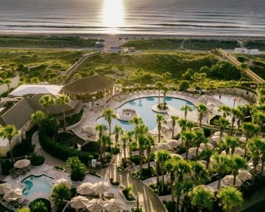 Ritz-Carlton Amelia Island resort pool with ocean views in the background.