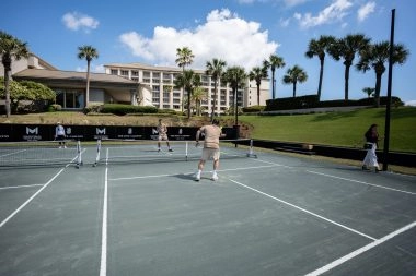 Players in action on the pickleball courts at the Ritz-Carlton Amelia Island resort.