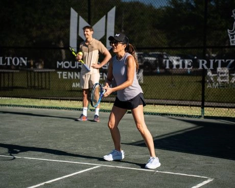 Player training under the guidance of a coach at Mouratoglou Tennis Center Amelia Island