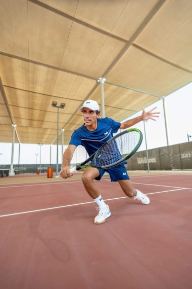 Coach Jaime in action at Mouratoglou Tennis Center Hudayriyat Island in Abu Dhabi, demonstrating technique and precision during an on-court training session.