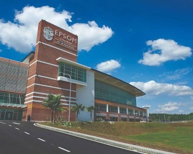 Epsom College in Malaysia campus building under a bright blue sky
