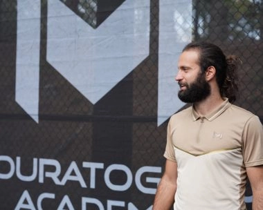 Head coach Federico standing in front of Mouratoglou windbreakers at Mouratoglou Academy Atlanta