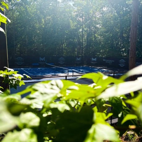 Mouratoglou Academy Atlanta tennis courts with players training under professional coaching