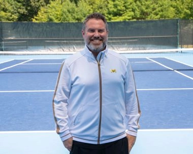 Coach wearing M Apparel on court at Mouratoglou Tennis Center Boston