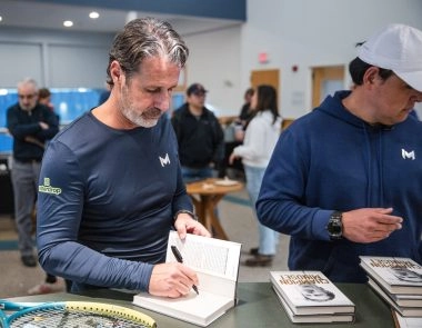 Patrick Mouratoglou signing his book during a special event at Mouratoglou Tennis Center Boston in Massachusetts