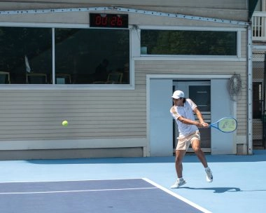 Tennis player competing on court at Mouratoglou Tennis Center Boston, Massachusetts
