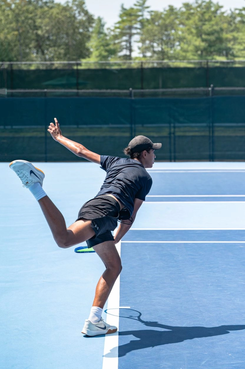 Tennis player serving during training at Mouratoglou Tennis Center Boston, Massachusetts