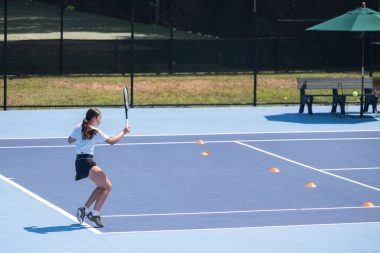 Young female player training at Mouratoglou Tennis Center Boston