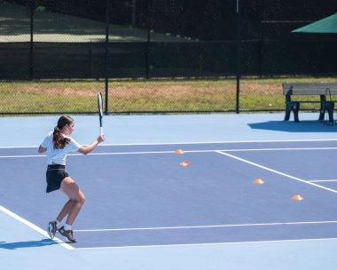 Young female player training at Mouratoglou Tennis Center Boston