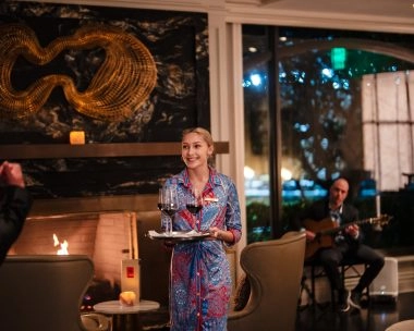 Waitress serving cocktails at the bar of The Ritz-Carlton, Amelia Island.