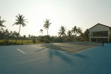 Professional hard tennis court at Mouratoglou Tennis Center Bali within a modern high-performance training complex.