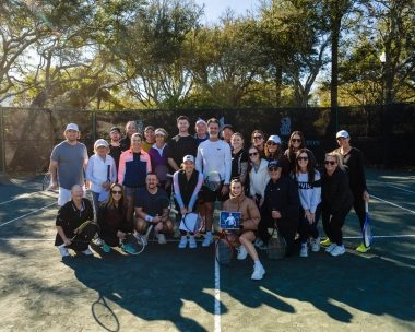 Group of adult players posing with Patrick Mouratoglou at Mouratoglou Tennis Center Amelia Island.