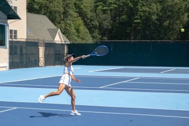 Adult female tennis player in action at Mouratoglou Tennis Center Boston, Massachusetts