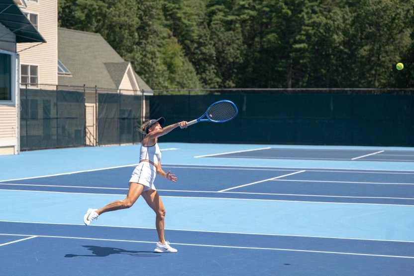 Adult female tennis player in action at Mouratoglou Tennis Center Boston, Massachusetts