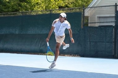 Tennis player hitting a forehand at Mouratoglou Tennis Center Boston in Massachusetts
