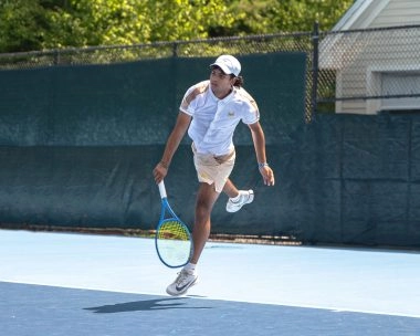 Tennis player hitting a forehand at Mouratoglou Tennis Center Boston in Massachusetts