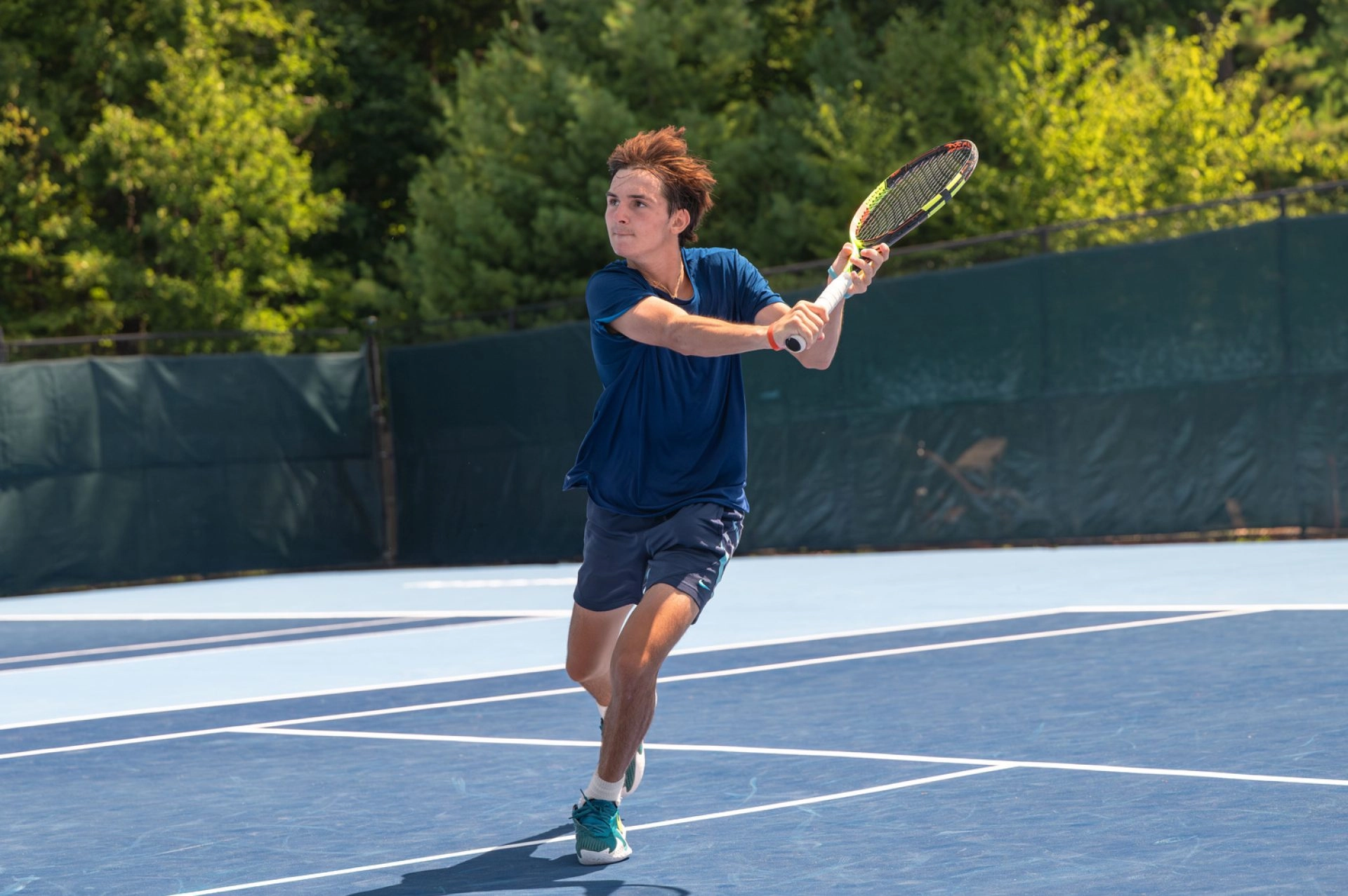 Young tennis player training on court in Mouratoglou Tennis Center Boston,Massachusetts