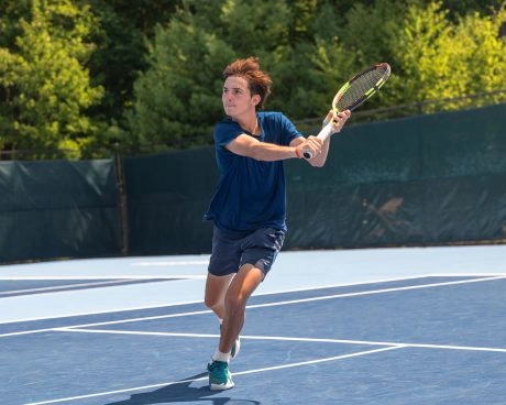 Young tennis player training on court in Mouratoglou Tennis Center Boston,Massachusetts