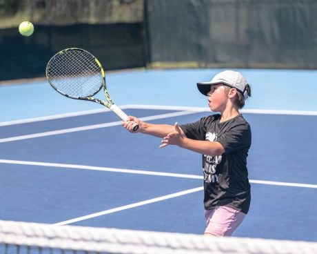 Child playing tennis at Mouratoglou Tennis Center Boston
