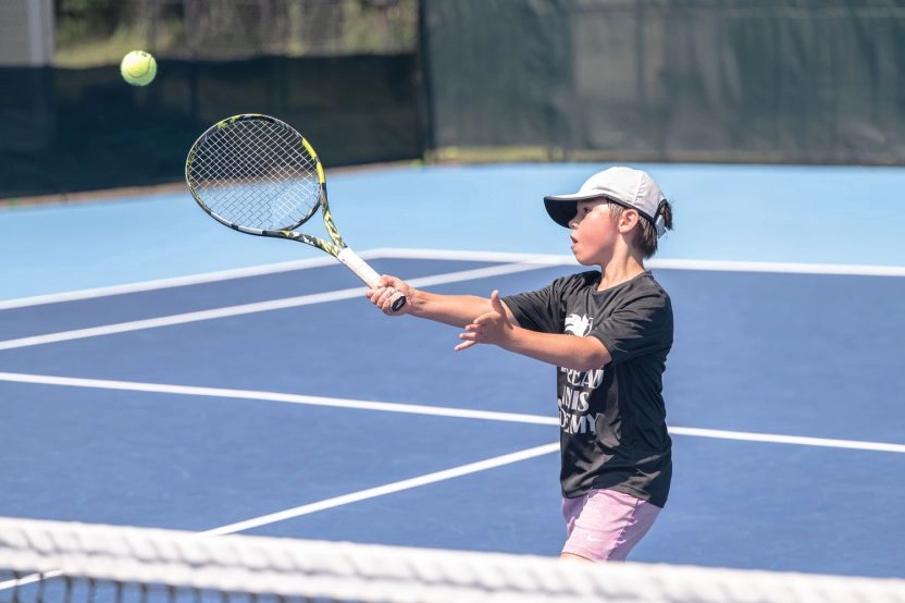 Child playing tennis at Mouratoglou Tennis Center Boston