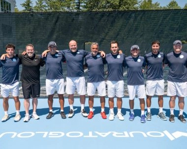 Team of professional tennis coaches on court in Massachusetts