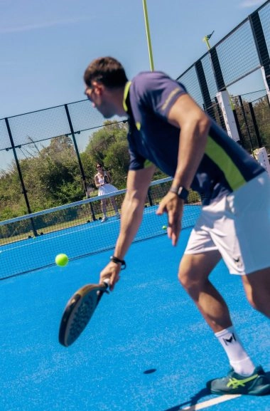 Padel players rallying at Mouratoglou Tennis Center Cala di Volpe in Sardinia.