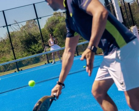 Padel players rallying at Mouratoglou Tennis Center Sardinia.