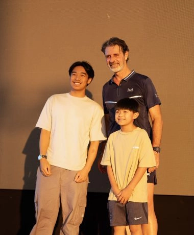 Patrick Mouratoglou posing with players during an event at Mouratoglou Tennis Center Hudayriyat Island in Abu Dhabi.
