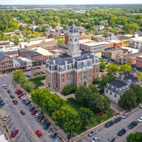 Aerial view of Noblesville downtown square with historic courthouse, surrounding buildings, and tree-lined streets in Indiana.