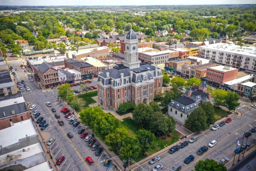 Aerial view of Noblesville downtown square with historic courthouse, surrounding buildings, and tree-lined streets in Indiana.