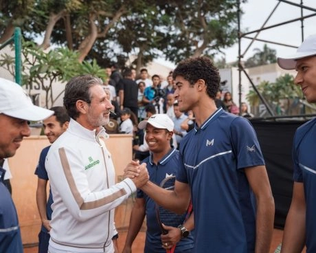Patrick Mouratoglou congratulating a young player with a handshake at Mouratoglou Tennis Center Palm Hills, Egypt