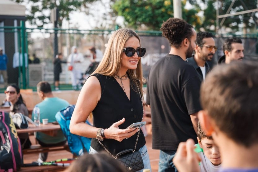 Guest interacting with players and families during a community event at Mouratoglou Tennis Center Palm Hills Cairo in Egypt.