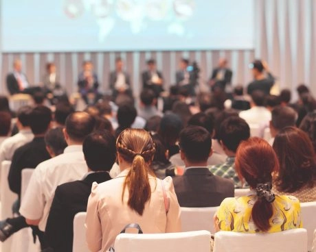 Audience attending a tennis-related conference or event organized by Mouratoglou Tennis Center.