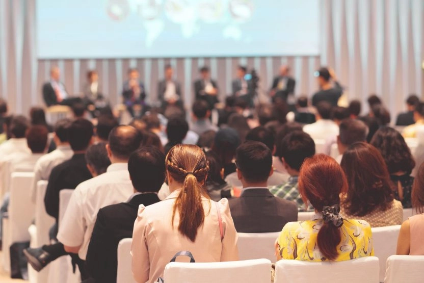 Audience attending a tennis-related conference or event organized by Mouratoglou Tennis Center.