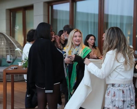 Guests socializing and networking during an exclusive reception event at Mouratoglou Tennis Center Bodrum.