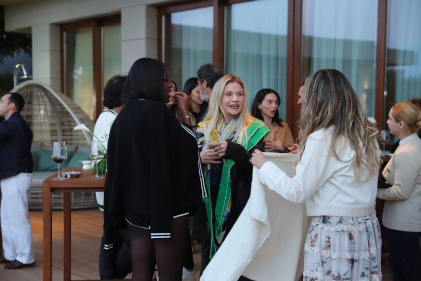 Guests socializing and networking during an exclusive reception event at Mouratoglou Tennis Center Bodrum.