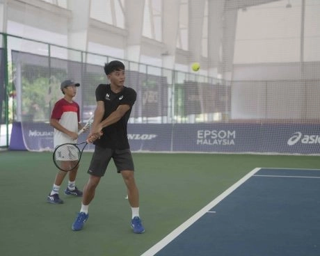 Junior tennis players practicing groundstrokes during a training session at Mouratoglou Academy Malaysia Kuala Lumpur.