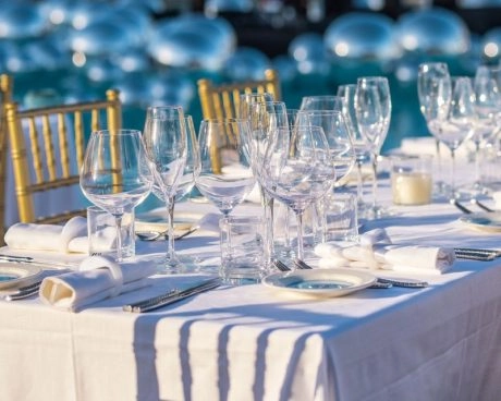 Elegant outdoor dining setup at Hotel Cala di Volpe prepared for a private event or gala dinner.