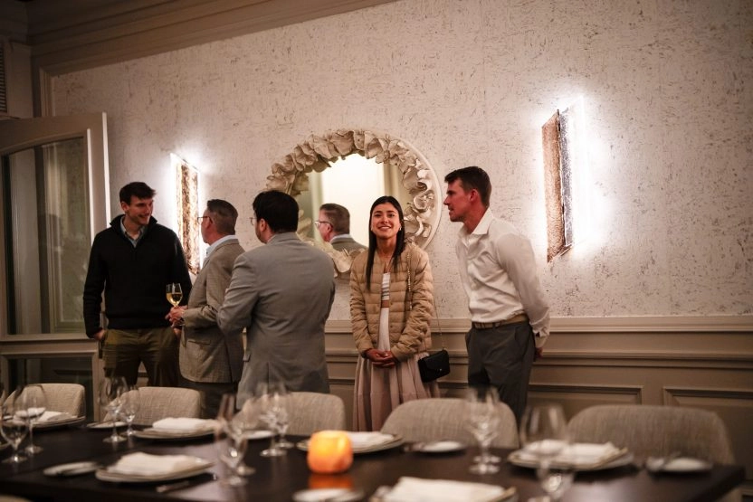 Two business professionals networking during an exclusive event at Mouratoglou Tennis Center Amelia Island.