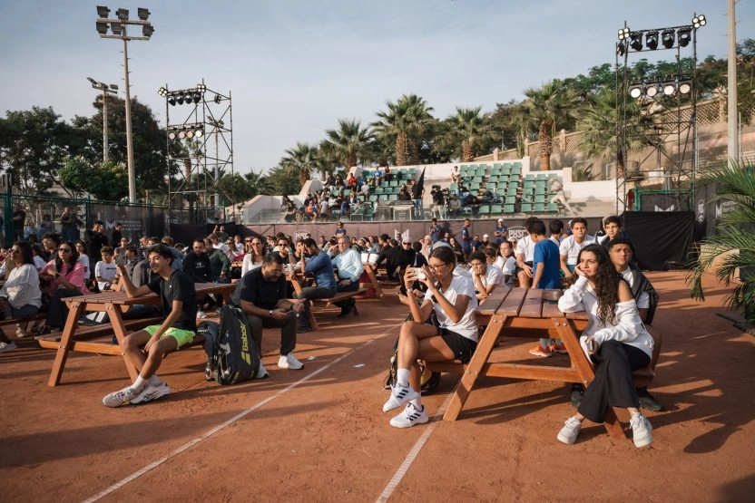Guests, families, and players attending a community event on the clay courts of Mouratoglou Tennis Center Palm Hills Cairo in Egypt.