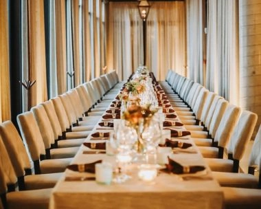 Elegant private event space with a long dining table set for guests at La Estancia, home of Mouratoglou Tennis Center Odessa Midland.